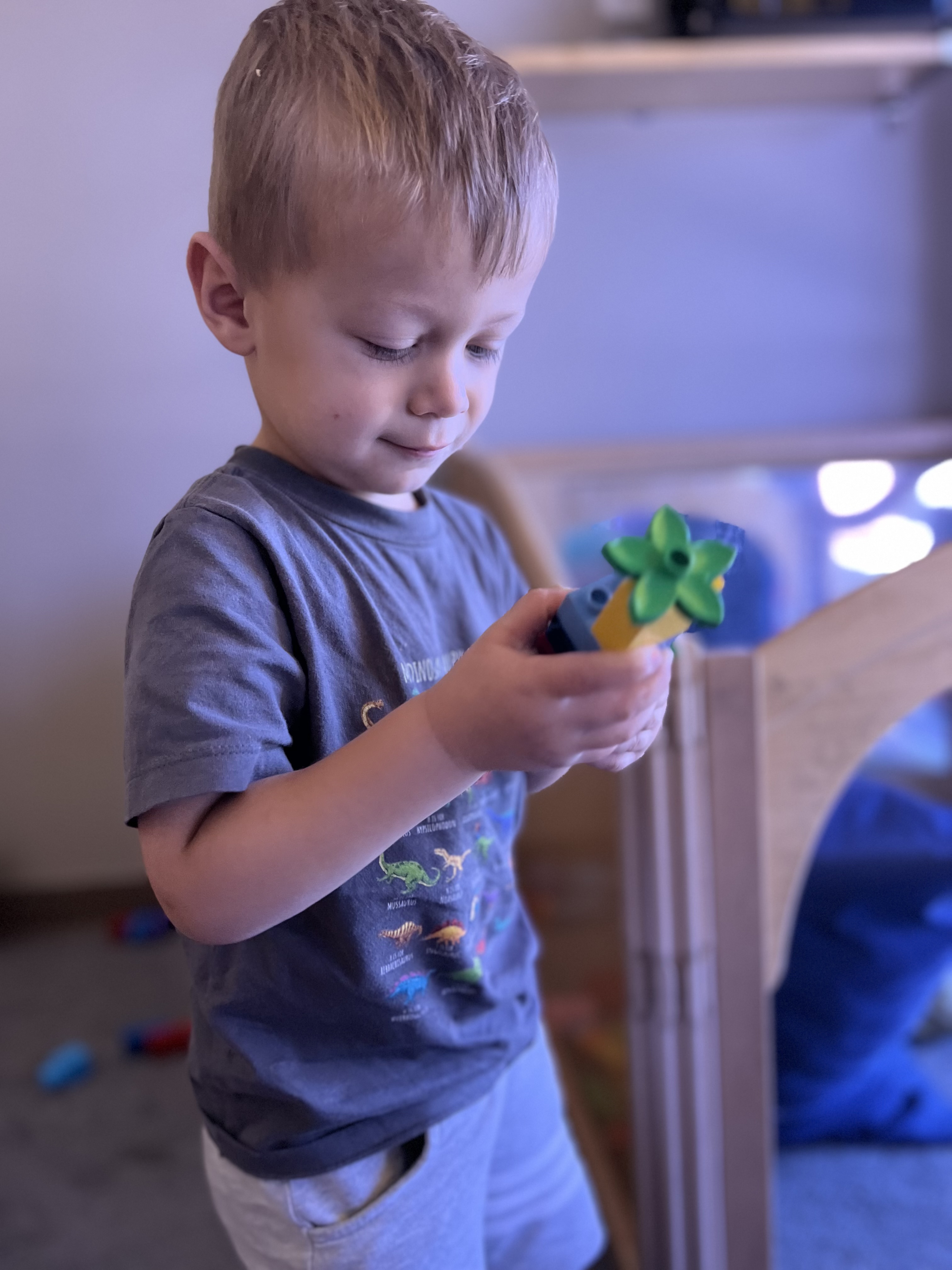 A toddler playing with Montessori learning materials